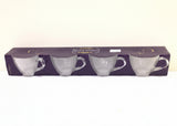 Packaging of clear glass teapots on a white background
