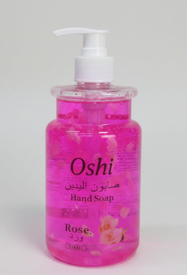 Hand soap bottle with rose fragrance on a white background