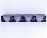 Packaged set of three white teacups on a white background