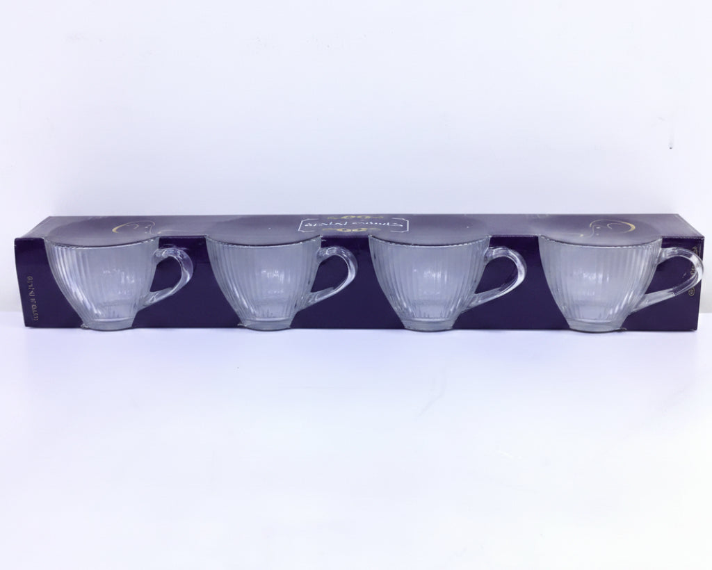 Packaged set of three white teacups on a white background