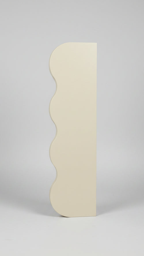 Beige shoe box on a shelf in a store with blurred background