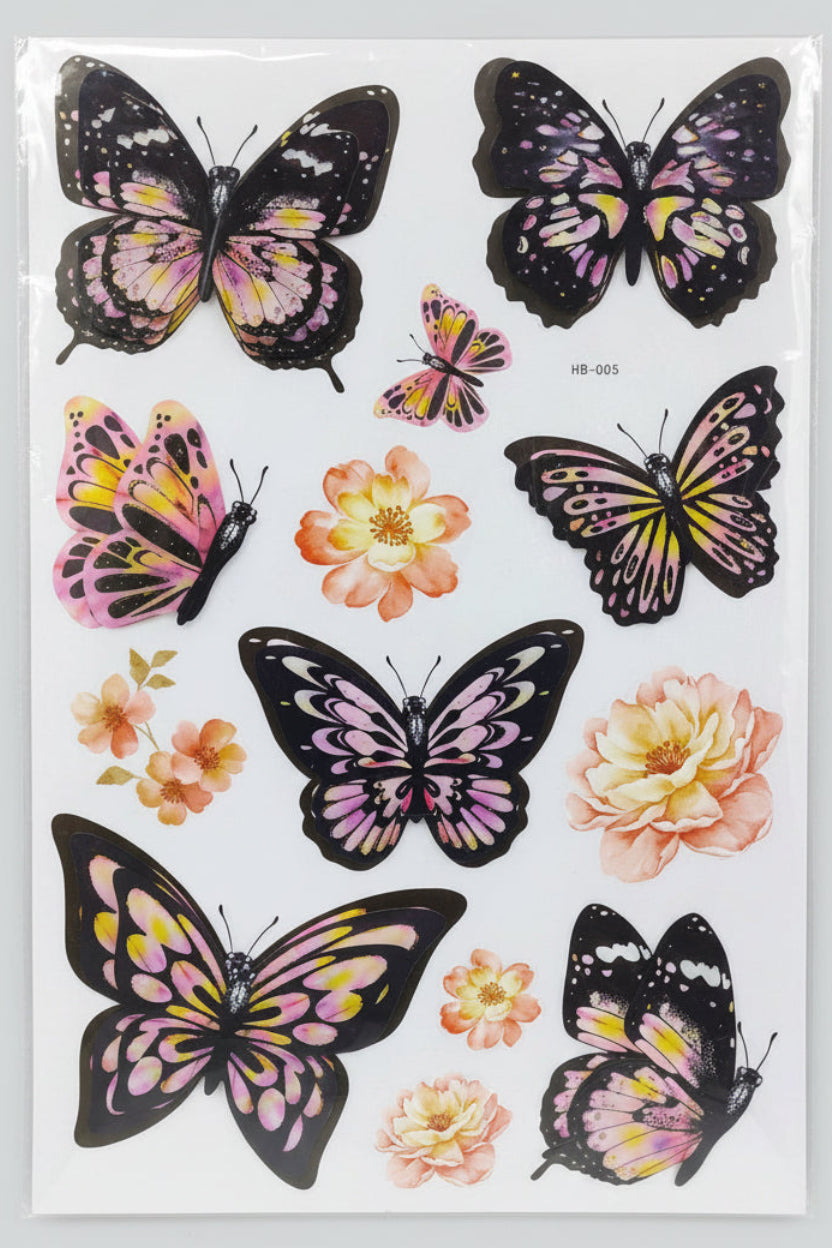 Butterfly and flower stickers in a clear packaging on a store shelf.