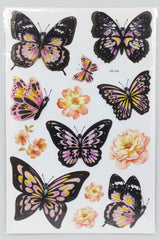 Butterfly and flower stickers in a clear packaging on a store shelf.